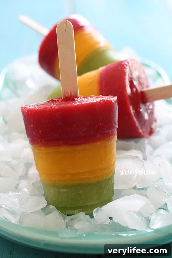 Hot summer's day? No problem, cool off with these homemade frozen fruit pops made with fresh mango, kiwi, and raspberry fruit puree.
