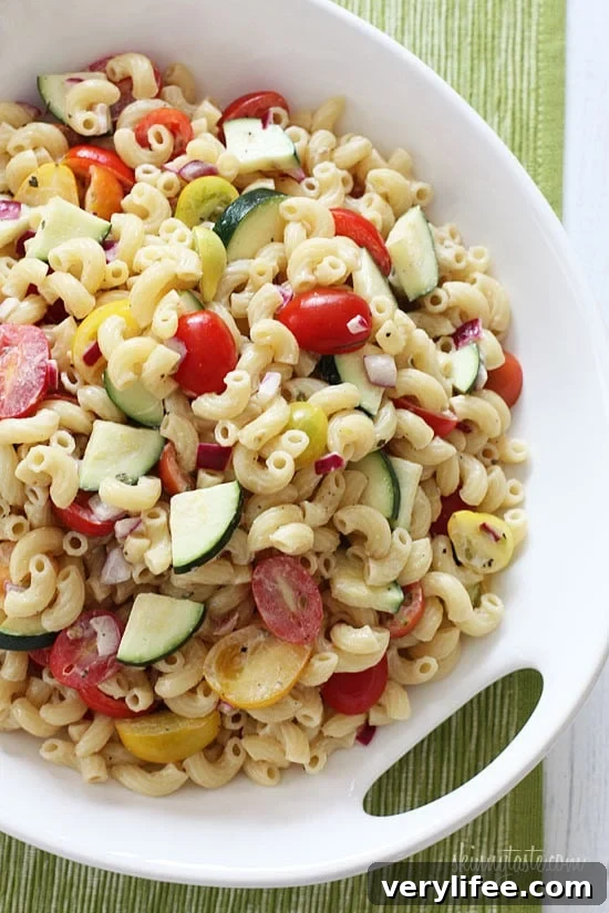 Refreshing Summer Macaroni Salad with Tomatoes and Zucchini 4 Macaroni Salad with Tomatoes and Zucchini is the perfect summer pasta salad loaded with fresh summer vegetables tossed in a light creamy dressing.