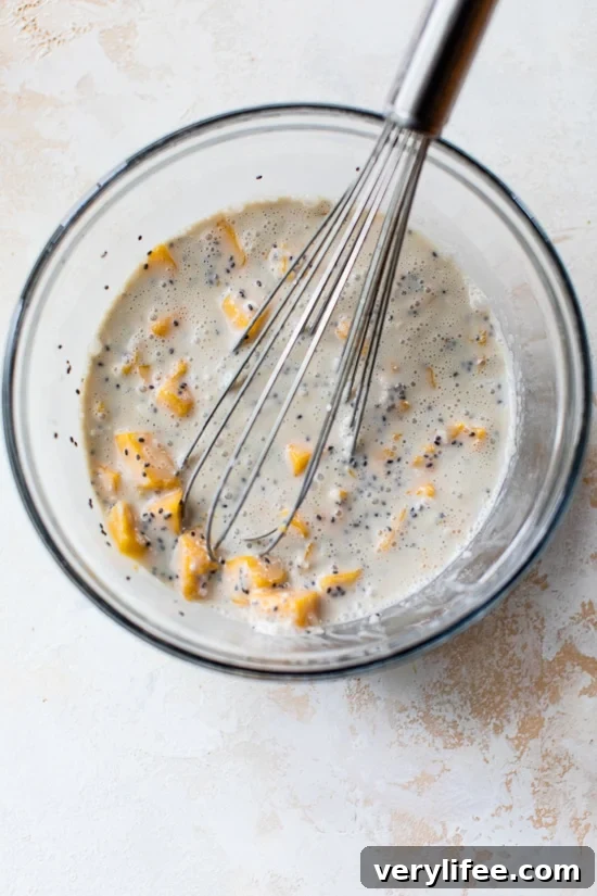 Ingredients for coconut chia pudding being mixed in a bowl.