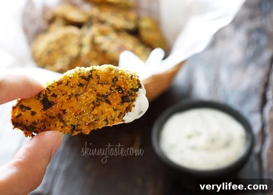 Cornmeal panko herb crusted dill pickles baked in the oven until golden and crisp with a light buttermilk ranch dip. Have you ever had fried pickles?
