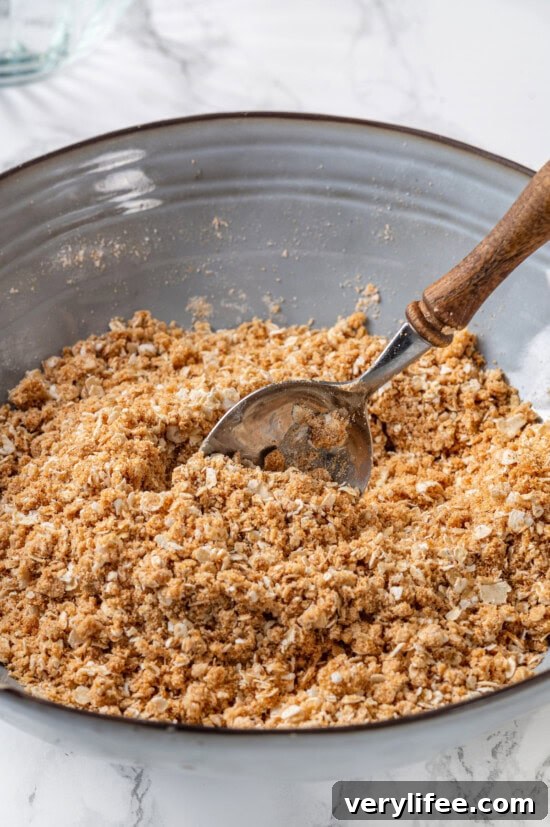 Topping ready to sprinkle Crisp topping in bowl with spoon