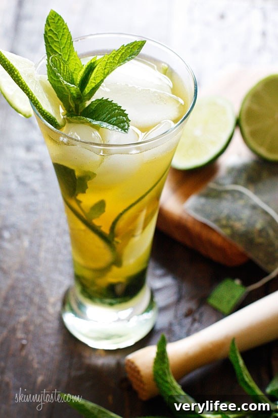Iced Green Tea Mojito Recipe with Fresh Mint and Lime 3 The perfect summer cocktail, a cross between a tall glass of fresh brewed iced green tea and a mojito! I think this is going to be my signature drink all summer, it's icy cool, and has the added bonus of antioxidant rich green tea.