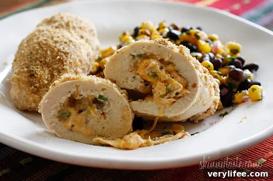 Crispy Baked Chicken Stuffed with Cheesy Jalapeno Poppers 3 What happens when you combine Baked Jalapeño Poppers with chicken?? Oh yeah baby!! Cheesy stuffed chicken breast stuffed with diced jalapeño, cream cheese, cheddar jack cheese, scallions and bacon!