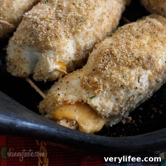 Crispy Baked Chicken Stuffed with Cheesy Jalapeno Poppers 5 What happens when you combine Baked Jalapeño Poppers with chicken?? Oh yeah baby!! Cheesy stuffed chicken breast stuffed with diced jalapeño, cream cheese, cheddar jack cheese, scallions and bacon!