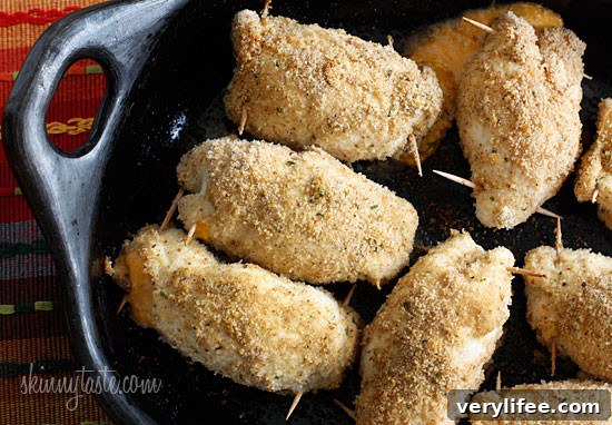 Crispy Baked Chicken Stuffed with Cheesy Jalapeno Poppers 6 What happens when you combine Baked Jalapeño Poppers with chicken?? Oh yeah baby!! Cheesy stuffed chicken breast stuffed with diced jalapeño, cream cheese, cheddar jack cheese, scallions and bacon!