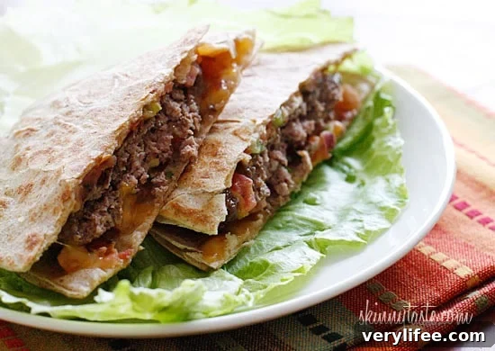 100% grass-fed buffalo burgers with melted cheddar jack cheese and pico de gallo wedged in between two whole wheat tortillas.