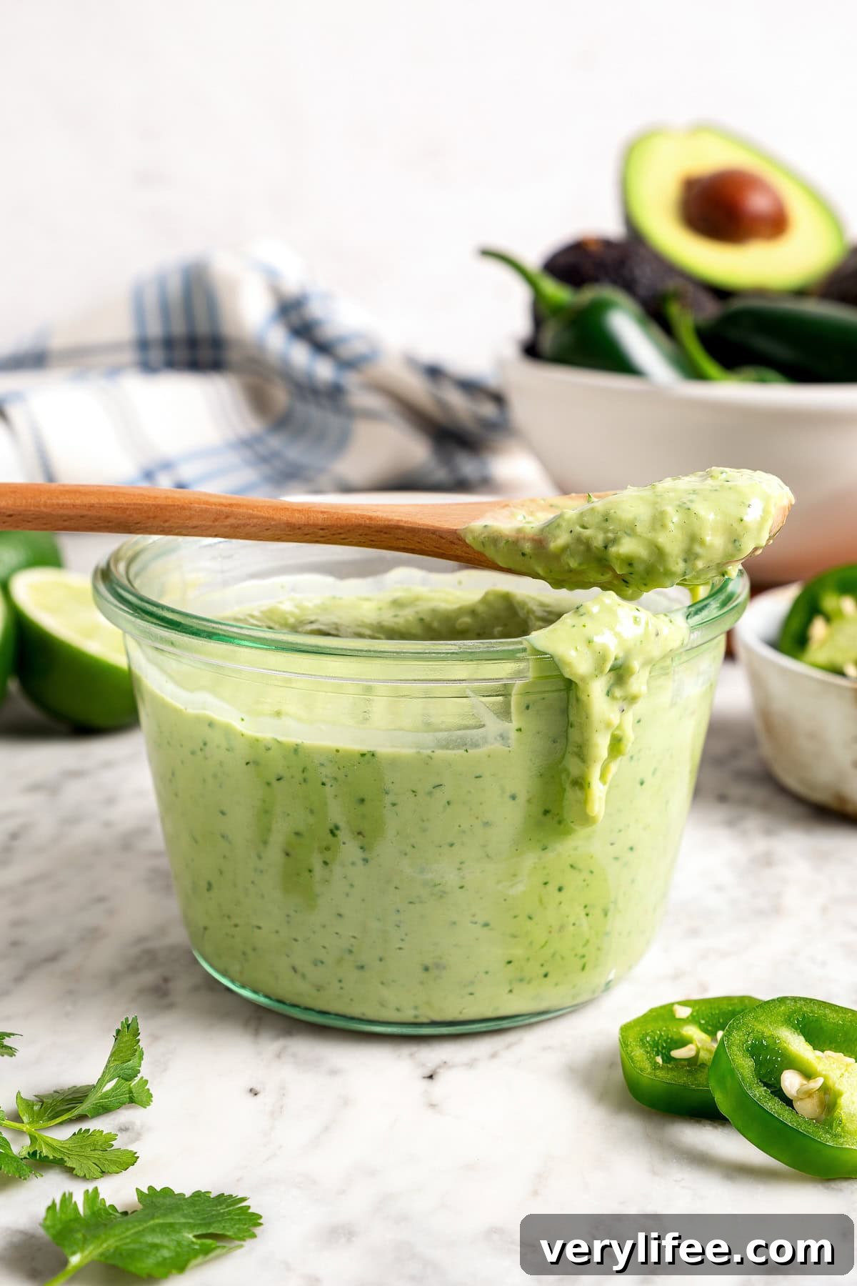 Creamy, bright, and tangy thanks to a buttermilk base, this avocado cilantro lime dressing is perfect for salads, tacos, and dipping veggies. Avocado Cilantro Lime Dressing in glass jar