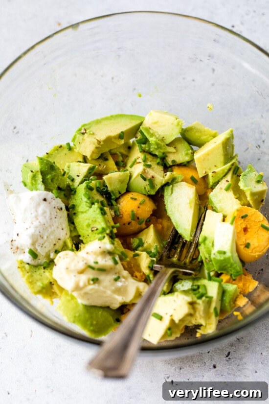 hard boiled eggs and avocado in a bowl.