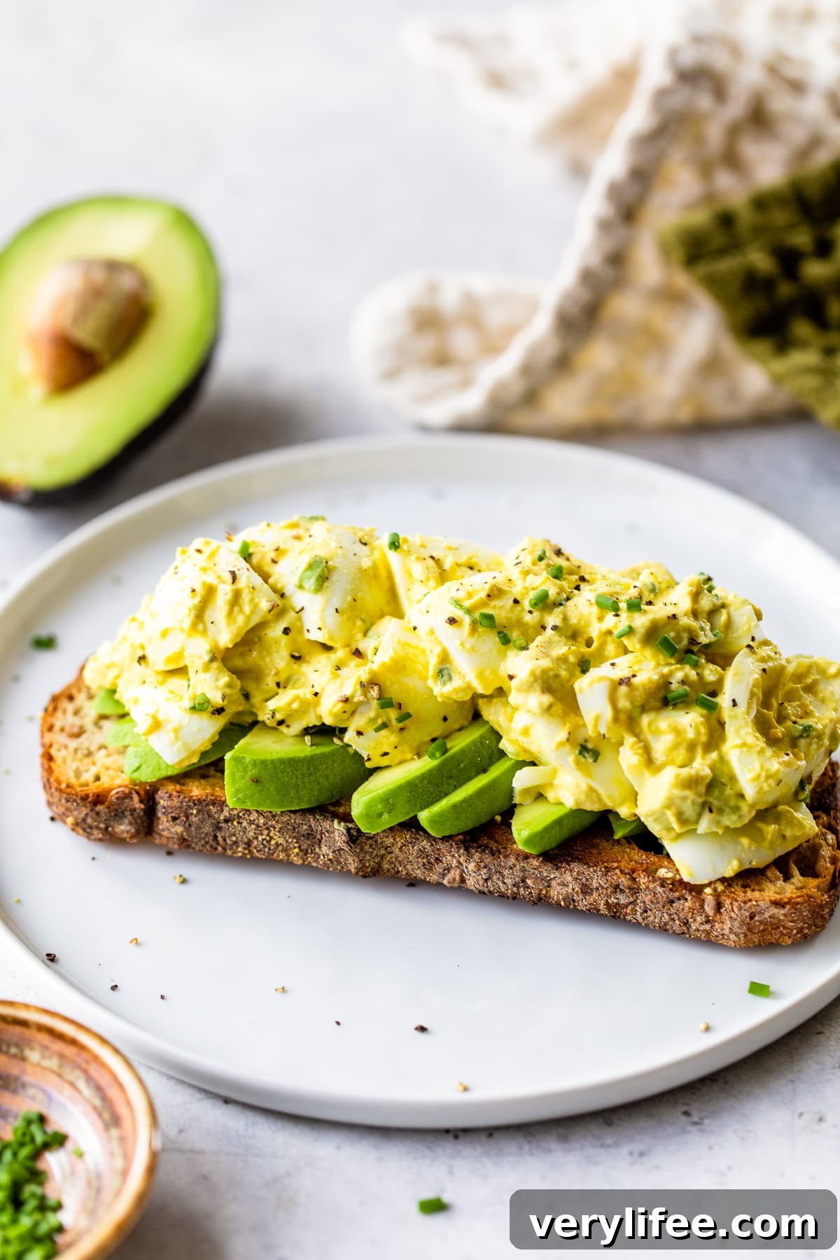 Avocado Egg Salad on a piece of toast.