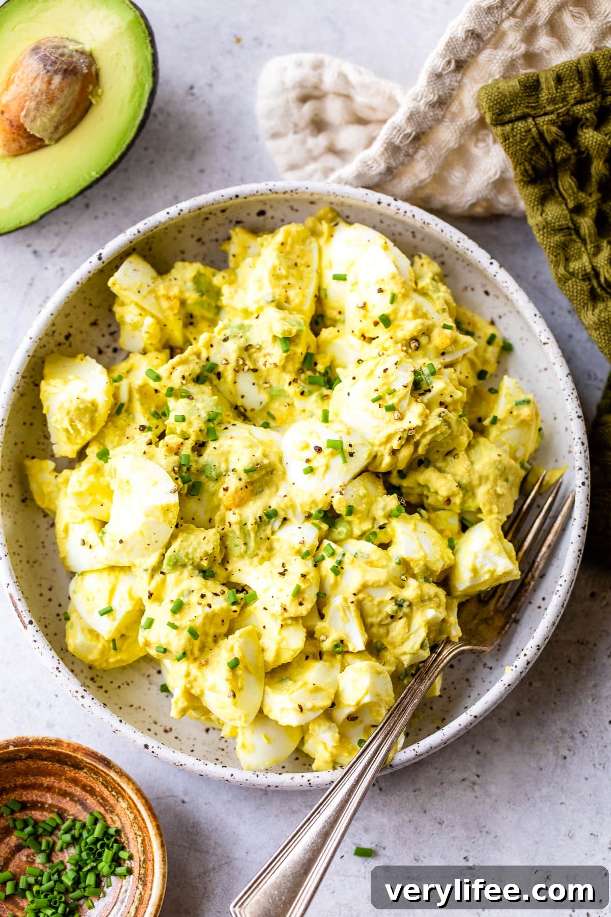 Avocado Egg Salad in a bowl with a fork.