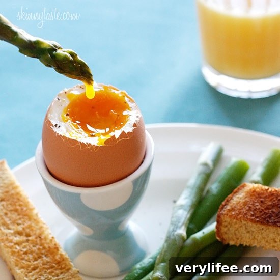 Soft boiled eggs with toast soldiers and asparagus