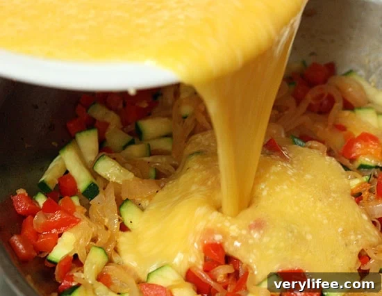Caramelized Onion, Red Pepper and Zucchini Skillet Frittata 10 Pour egg mixture over sauteed veggies.