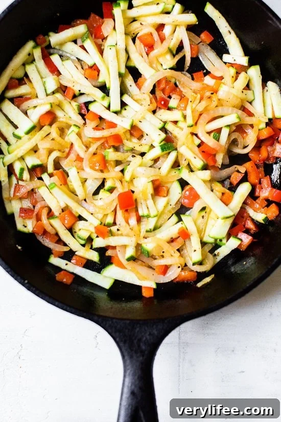 Caramelized Onion, Red Pepper and Zucchini Skillet Frittata 3 Caramelized Onion Red Pepper and Zucchini in a skillet.