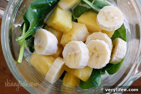 A skinny tropical green smoothie made with pineapple, shredded coconut and bananas, then blended with spinach, light coconut milk and Greek yogurt. High in Vitamin A, B-6, C, Manganese and fiber.