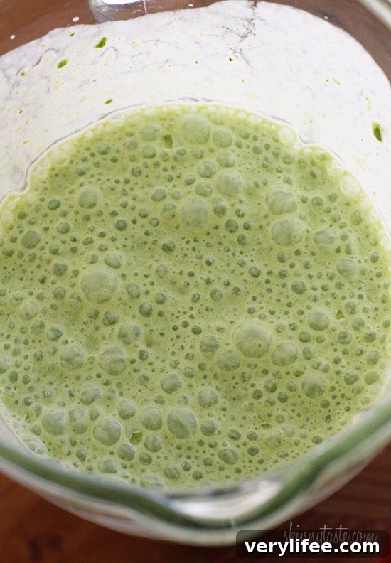 A skinny tropical green smoothie made with pineapple, shredded coconut and bananas, then blended with spinach, light coconut milk and Greek yogurt. High in Vitamin A, B-6, C, Manganese and fiber.