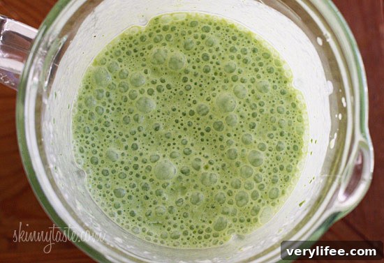 A skinny tropical green smoothie made with pineapple, shredded coconut and bananas, then blended with spinach, light coconut milk and Greek yogurt. High in Vitamin A, B-6, C, Manganese and fiber.