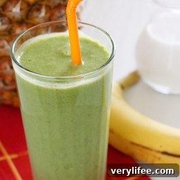 A skinny tropical green smoothie made with pineapple, shredded coconut and bananas, then blended with spinach, light coconut milk and Greek yogurt. High in Vitamin A, B-6, C, Manganese and fiber.