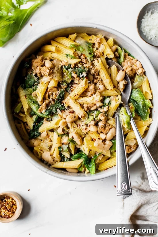 Pasta with Italian Chicken Sausage, Escarole and Beans is ridiculously good made with lots of garlic, lean Italian chicken sausage, and white cannellini beans.