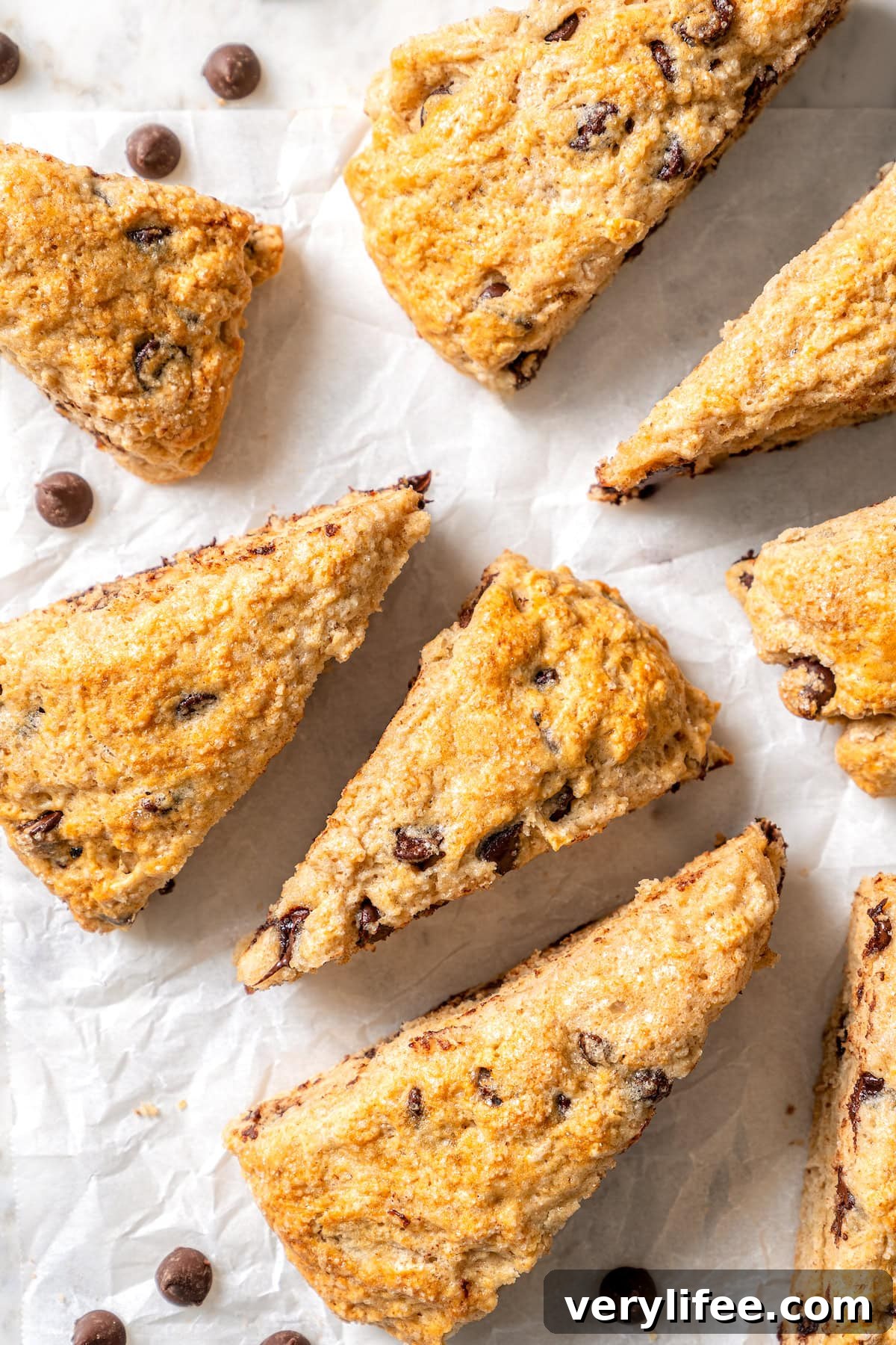 Chocolate Chip Scones Recipe: Tender, Buttery, Flaky 11 Overhead view of healthy chocolate chip scones on parchment paper