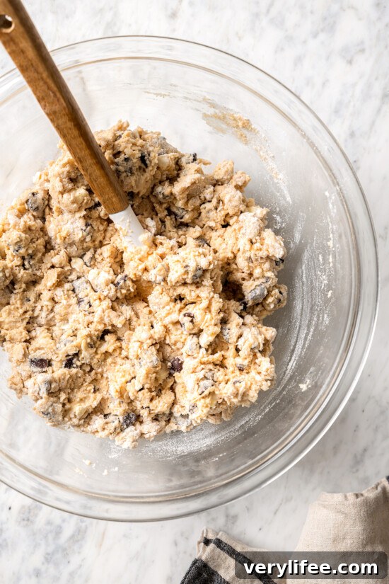 Chocolate Chip Scones Recipe: Tender, Buttery, Flaky 6 Overhead view of dough for chocolate chip scones in mixing bowl