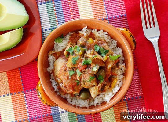 Chicken a la Criolla, a simple yet flavorful Latin dish made with stewed boneless skinless chicken thighs bell peppers, onions, garlic, tomatoes, olives, cilantro and spices.