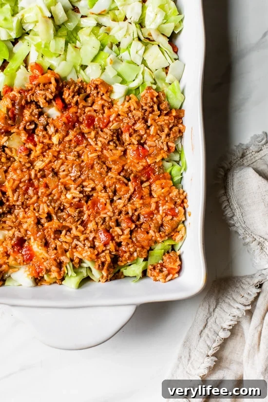 This Stuffed Cabbage Casserole is basically a deconstructed version of stuffed cabbage layered with shredded cabbage, ground beef and brown rice cooked in tomatoes then topped with melted cheese. It's SO good!