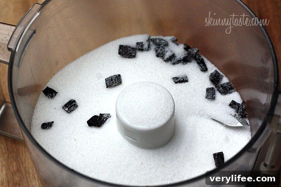 Close-up of vanilla bean specks in sugar.