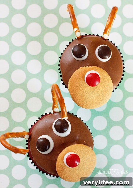 Red velvet yogurt cupcakes topped with a chocolate glaze. These festive reindeer cupcakes are easy to make perfect for a Holiday party!