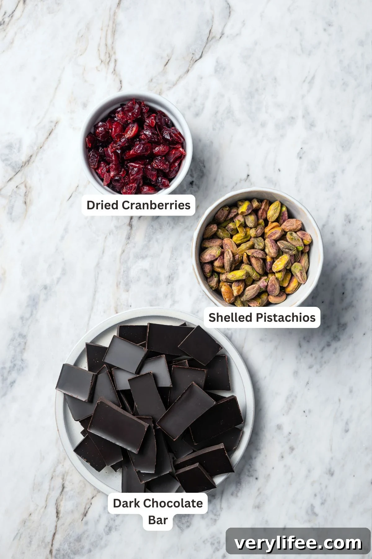 Dark Chocolate Bark with Pistachios and Cranberries Recipe 4 Ingredients for dark chocolate bark with pistachios and cranberries.