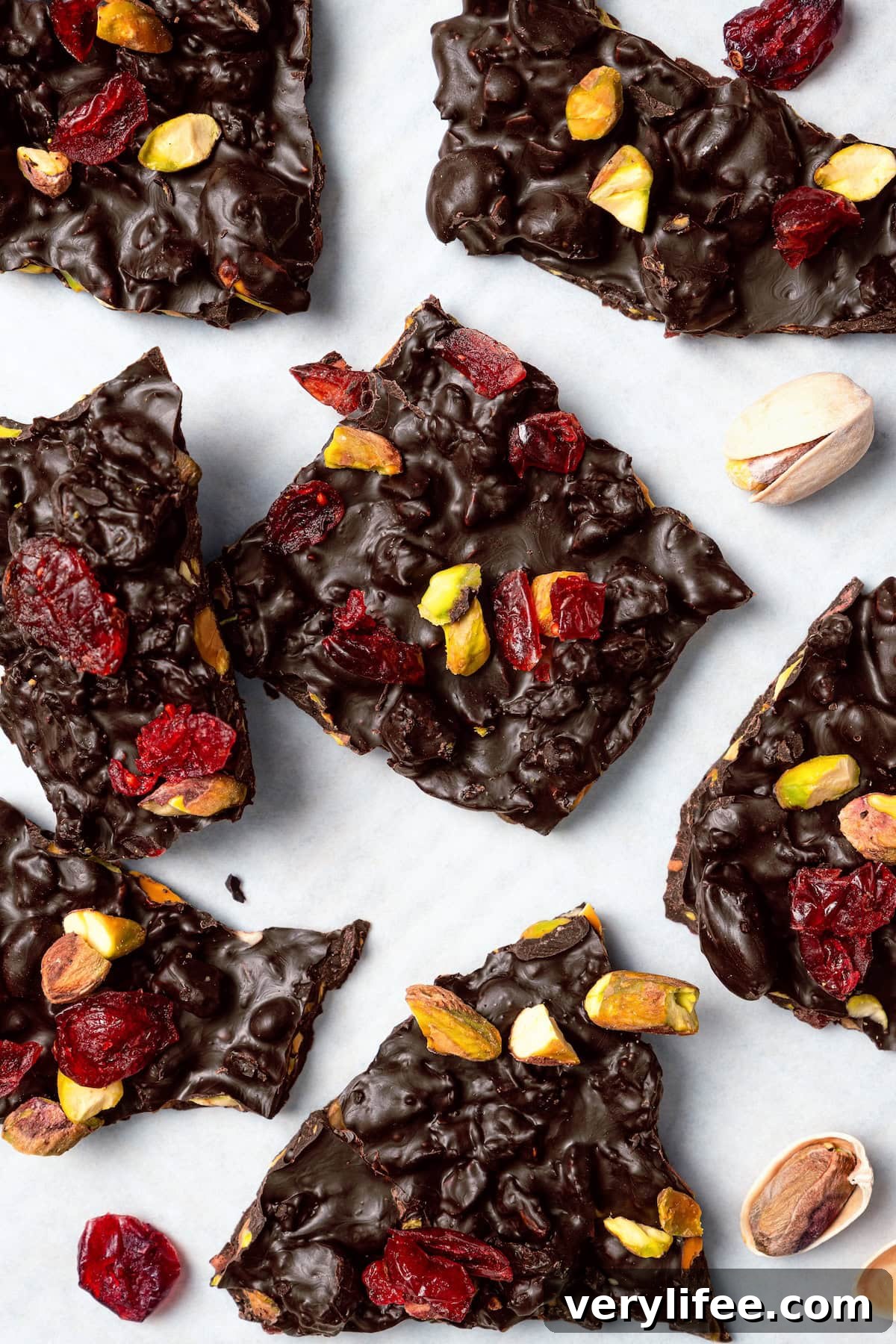 Pistachio and cranberry dark chocolate bark Pistachio and cranberry dark chocolate bark on countertop.
