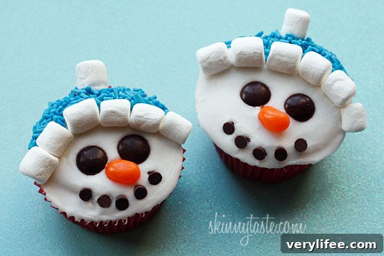 With Christmas just around the corner, these adorable holiday vanilla snowman cupcakes are low fat, easy to make and they are a hit with the kids! 