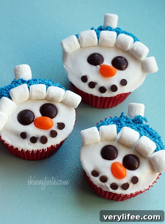 With Christmas just around the corner, these adorable holiday vanilla snowman cupcakes are low fat, easy to make and they are a hit with the kids! 