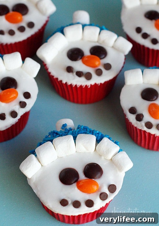 With Christmas just around the corner, these adorable holiday vanilla snowman cupcakes are low fat, easy to make and they are a hit with the kids! 