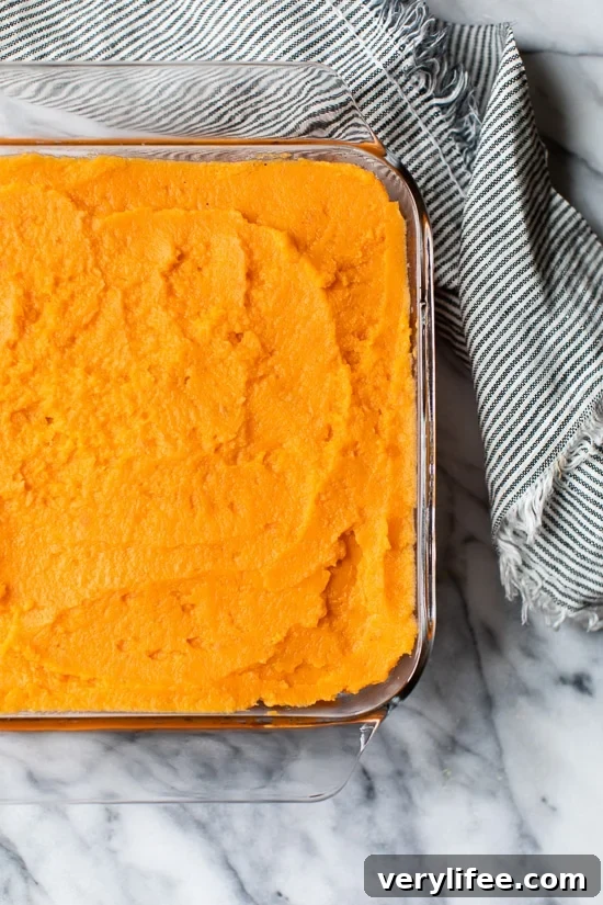 Mashed Sweet Potatoes Brulee are seasoned with with a hint of cinnamon and nutmeg topped with a caramelized brown sugar crust.