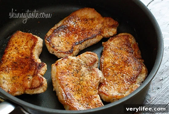 Pork loins being lightly pan fried.