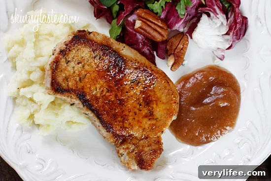 Pork loin chops, seasoned with paprika, sage, thyme and spices then lightly pan fried and served with homemade applesauce.