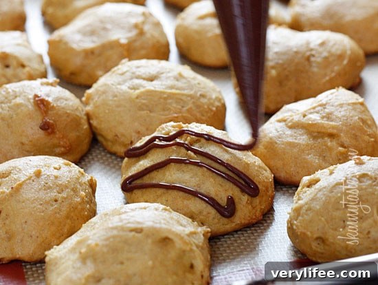 Low-fat pumpkin spice cookies have a cake ball quality to them, drizzled with a chocolate glaze, they are seriously good!