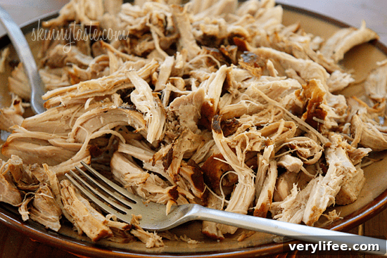 Boneless pork roast slow cooked in Asian spices creates an aromatic pork dish with mushrooms and broth, perfect over noodles or rice with fresh chopped green onions, cilantro and sriracha.