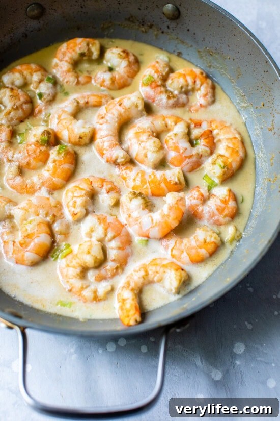 Shrimp in Thai Green Curry with Coconut Milk 7 Skillet with shrimp, coconut milk and green curry paste.