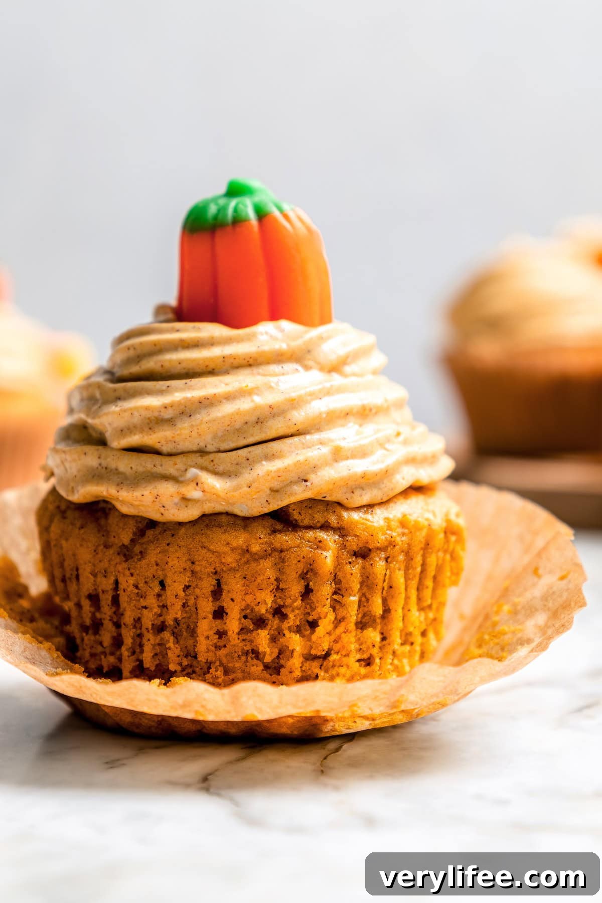 Moist pumpkin cupcake with pumpkin cream cheese frosting