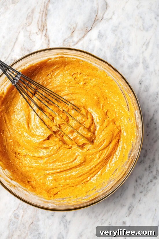 Overhead view of pumpkin cupcake batter in bowl