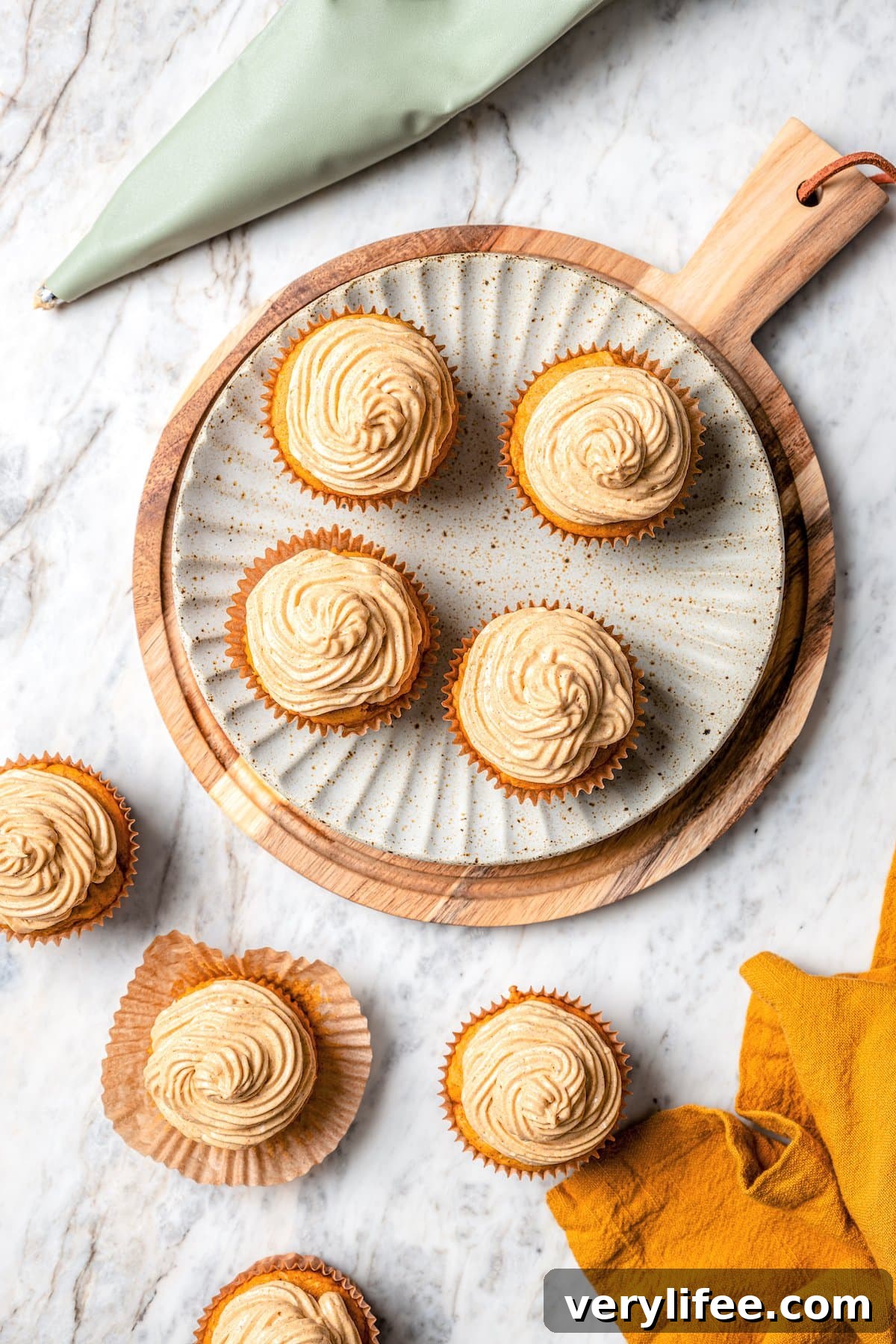 Overhead view of pumpkin cupcakes with pumpkin spice frosting