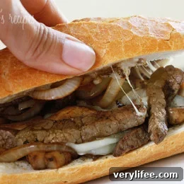Steak and Cheese Sandwiches with Onions and Mushrooms