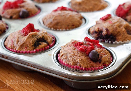 Whole Wheat Mixed Berry Muffins Recipe 4 Close up of mixed berry whole wheat muffins with raspberries, blueberries and blackberries.