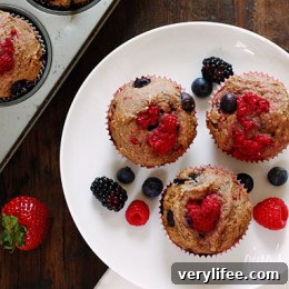 Whole Wheat Mixed Berry Muffins Recipe 5 One mixed berry whole wheat muffin on a plate.