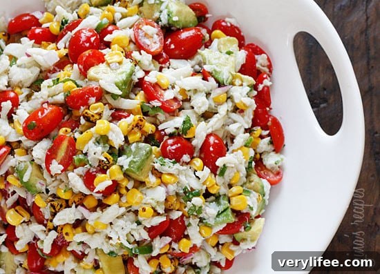 A wonderful summer salad made with lump crab meat, summer tomatoes, sweet charred roasted corn, cilantro, hot peppers and zesty lime juice. Serve this over mixed greens or tostadas as a main dish or you can put this in martini glasses as a fancy appetizer.