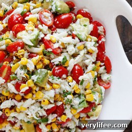 A wonderful summer salad made with lump crab meat, summer tomatoes, sweet charred roasted corn, cilantro, hot peppers and zesty lime juice.