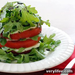 Caprese Tower with Arugula, Tomato and Mozzarella 3 Salad plate with tomato and mozzarella