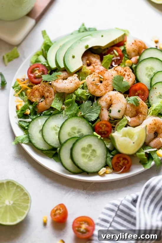 Shrimp Cobb Salad with avocados, grilled corn, black bean salsa, cucumbers, tomatoes and cheese.