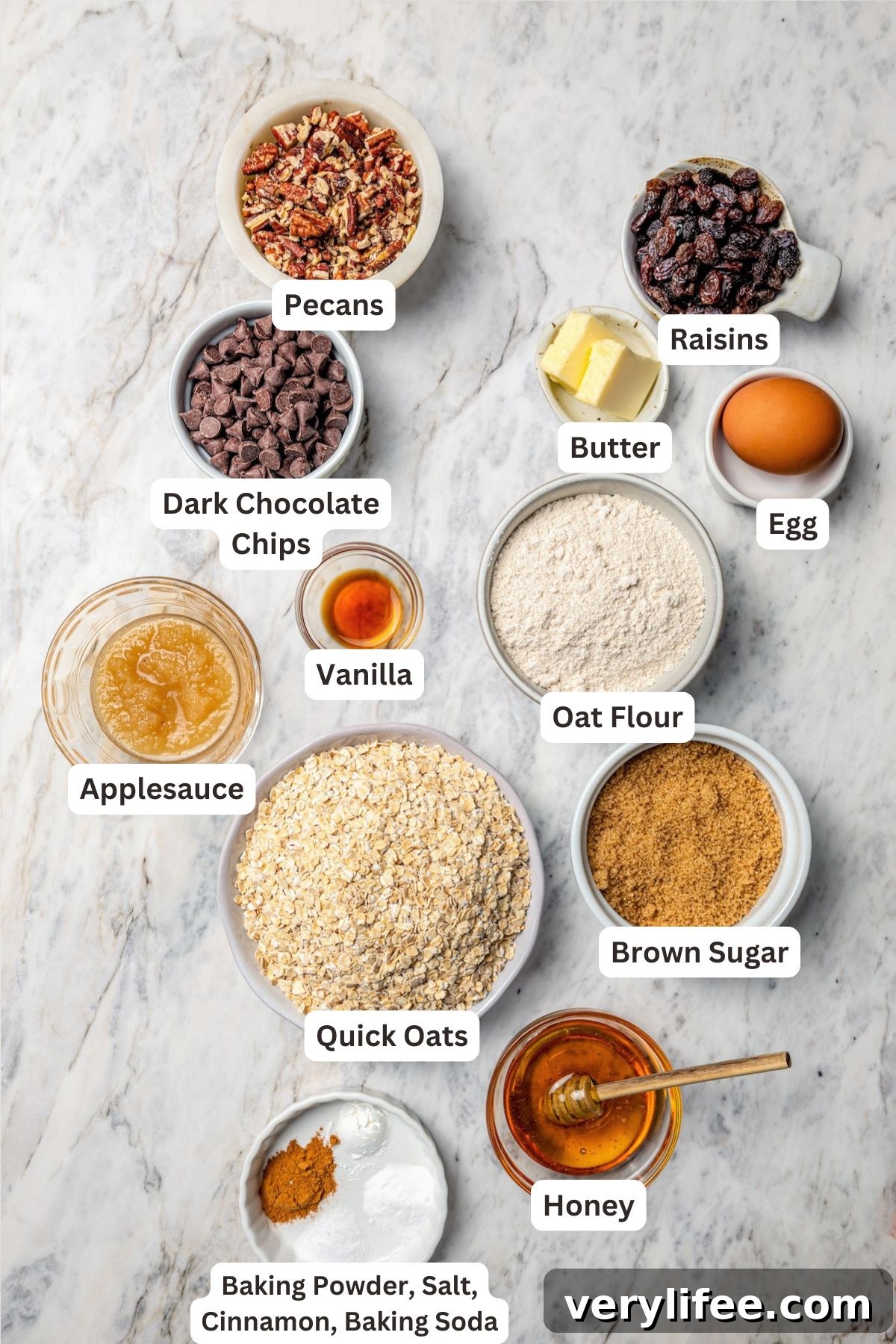 Homemade Chewy Pecan, Raisin and Chocolate Chip Granola Bars 5 Ingredients for chewy granola bars with labels.